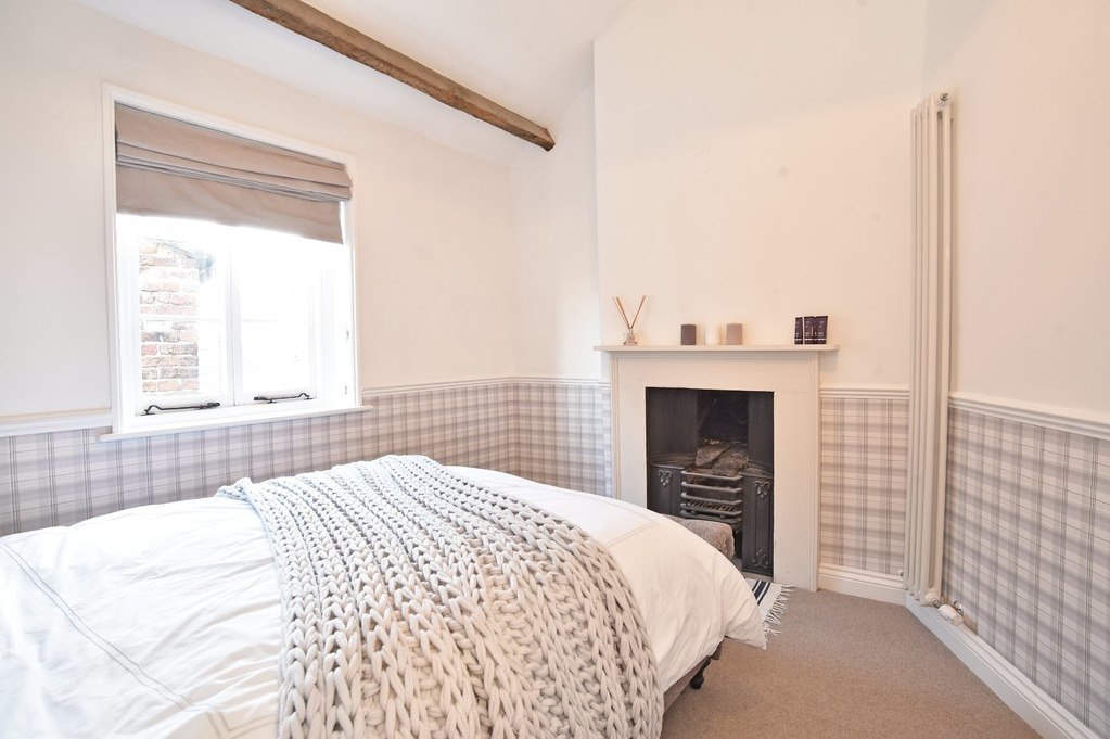 Bedroom with fireplace at Castlegate House